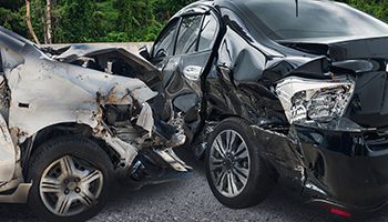 Two damaged cars after a collision on the road