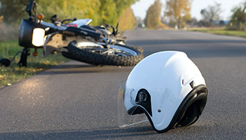 Motorcycle helmet and motorcycle on ground