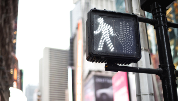 Pedestrian crossing sign on street